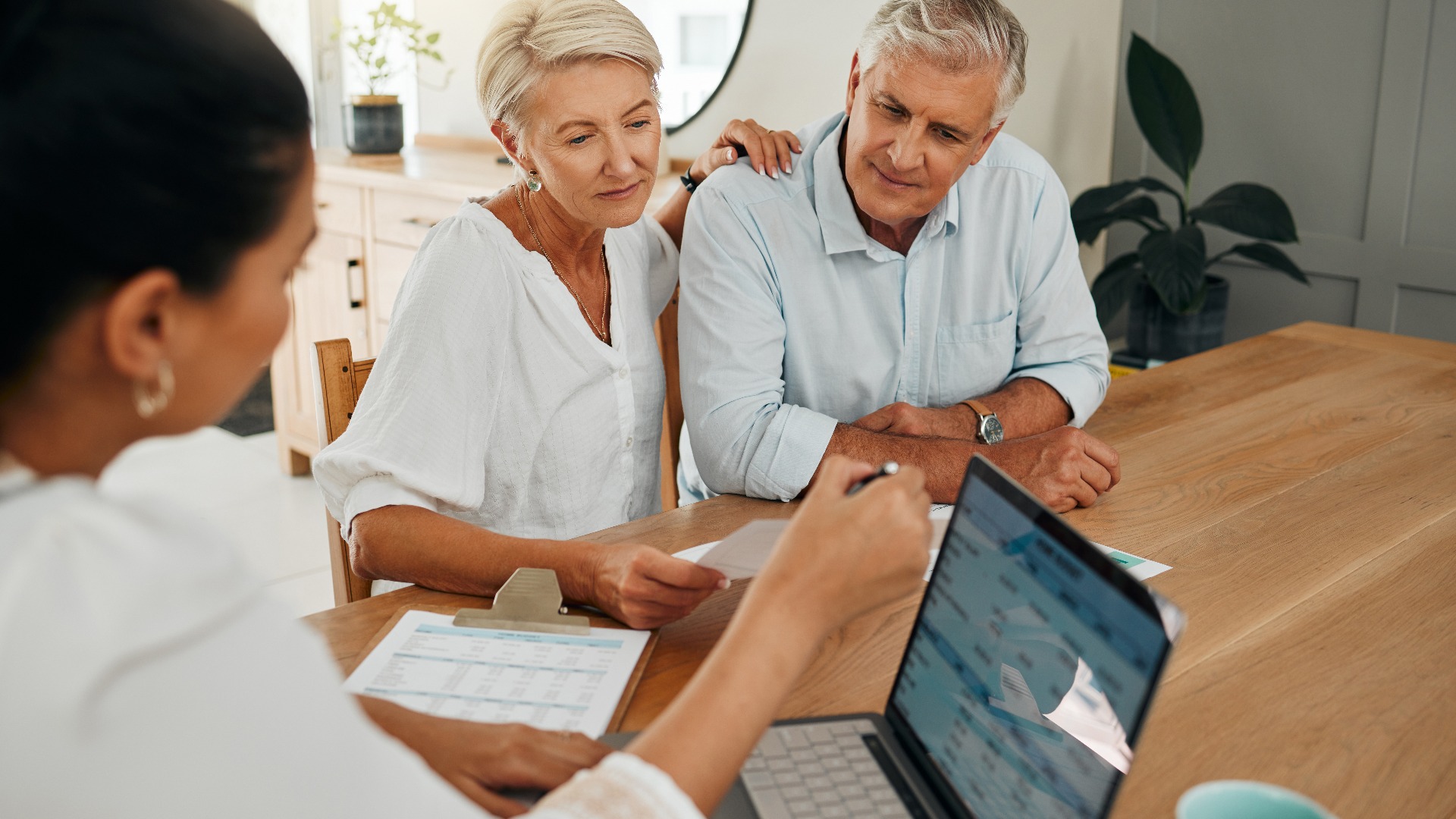 Financial advisor consultation with clients on retirement, finance planning or investment and document on laptop screen. Accountant woman, senior people and pension advice, asset management or budget