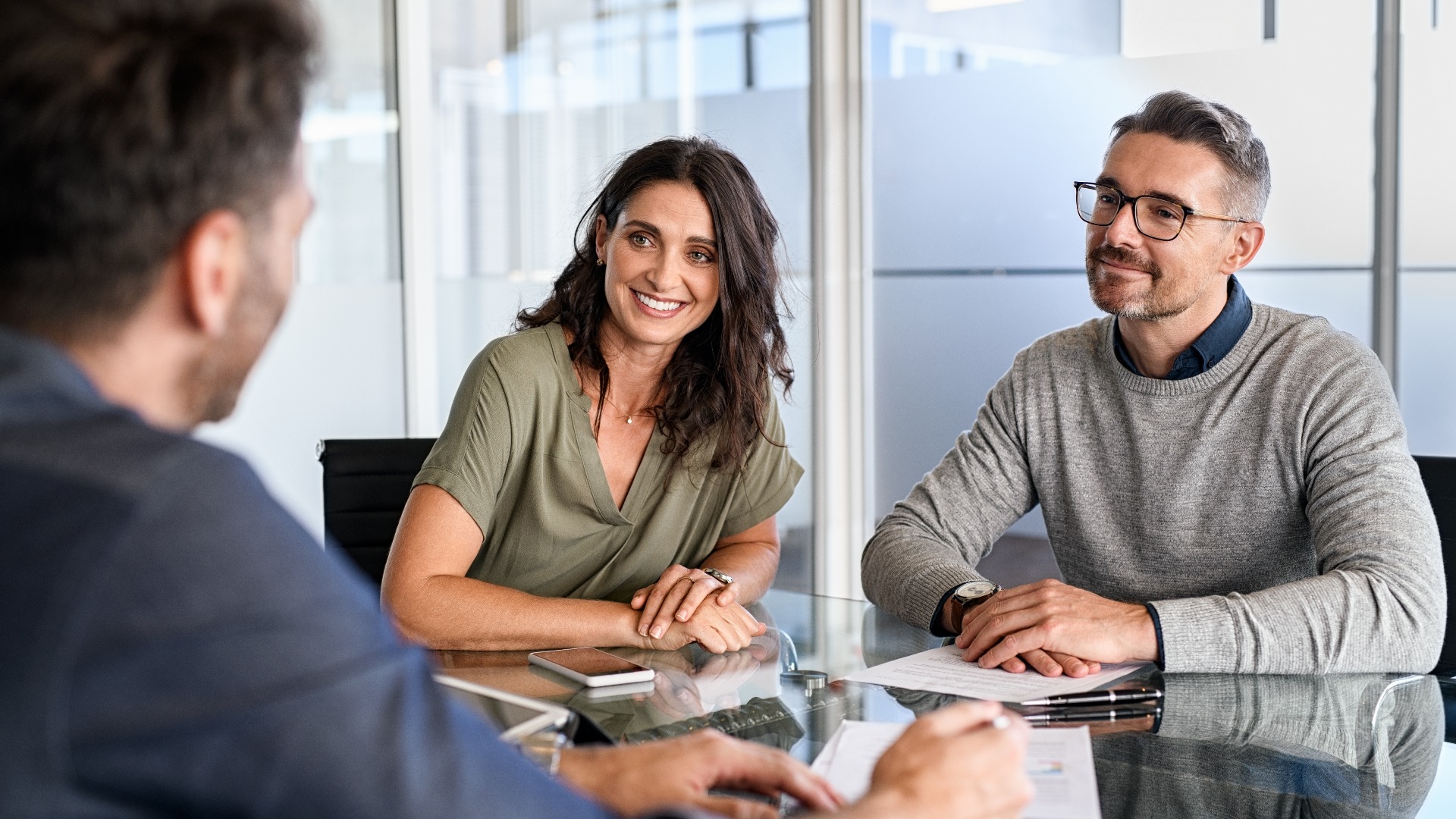 Mature couple meeting financial advisor for investment